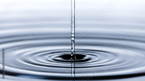 Water droplet splash background texture isolated on white. Fresh clean pure water ripples and splashes.
