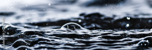 Water droplet splash background texture isolated on white. Fresh clean pure water ripples and splashes.