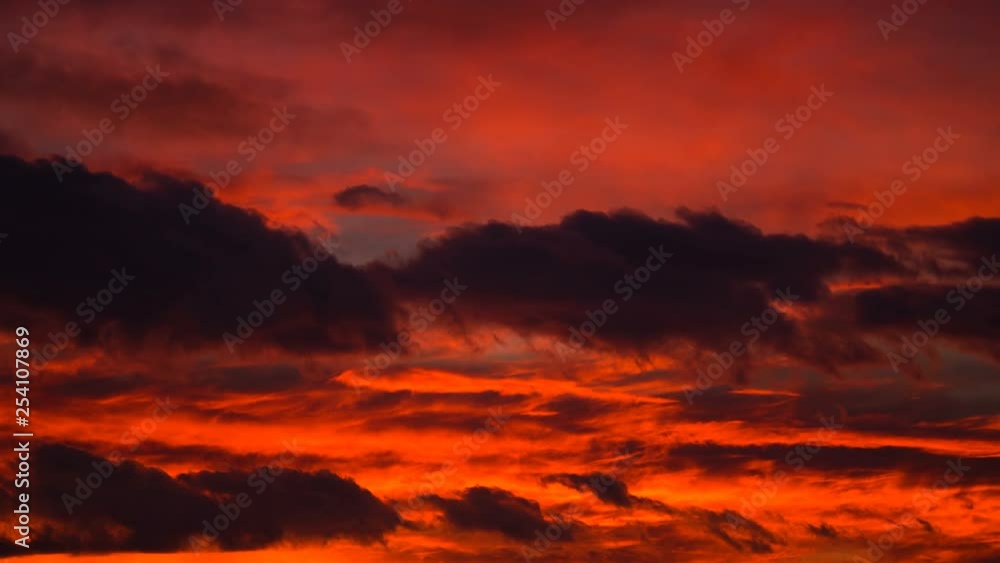Orange sunset sky and drak clouds nature timelapse background. Orange sunset sky and drak clouds nature timelapse background.