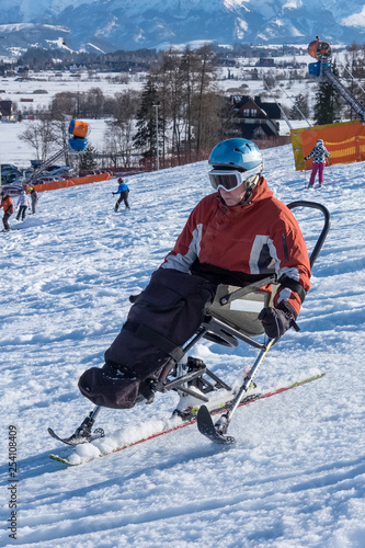 adult disabled man downhill sit ski photo