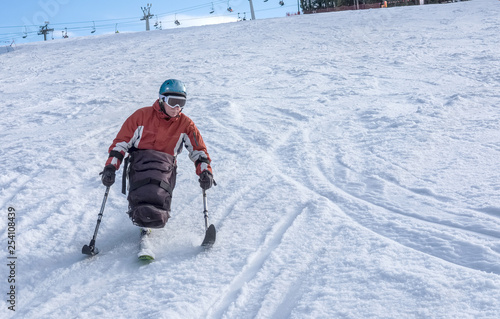 disabled athlete and  Winter Sport,  handicapped person and Mono Ski, handicapped athlete goes mono ski downhill skiing