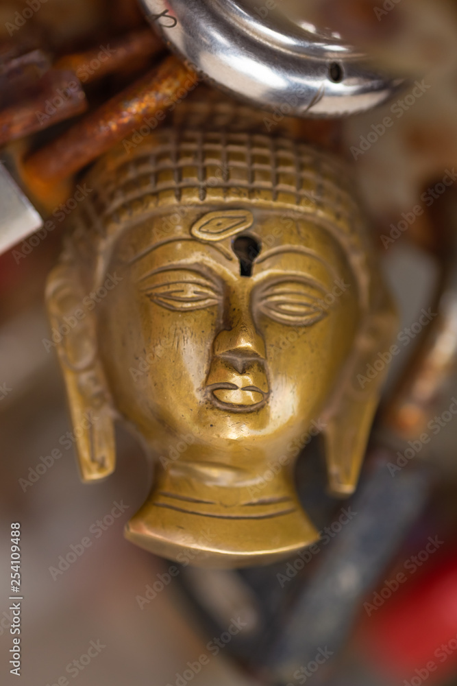 Buddha head padlock close up.