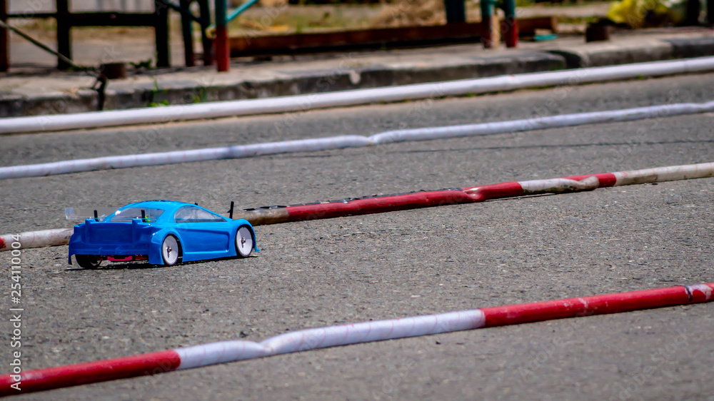 remote control car race competition on tarmac circuit