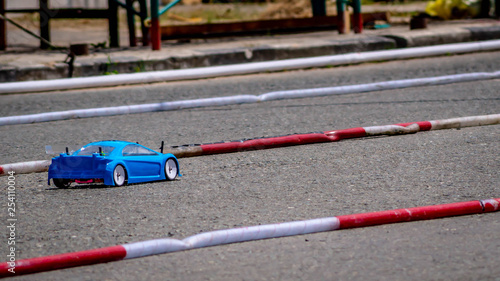 remote control car race competition on tarmac circuit