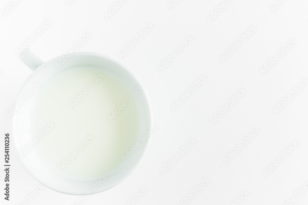 milk in a round white mug on a white background milk in a round white mug on a white background