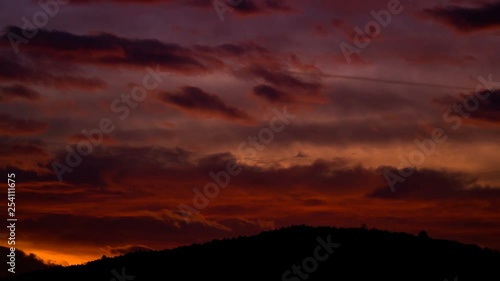 Orange, red colors of sunset sky, evening ssun light landscape timelapse. photo