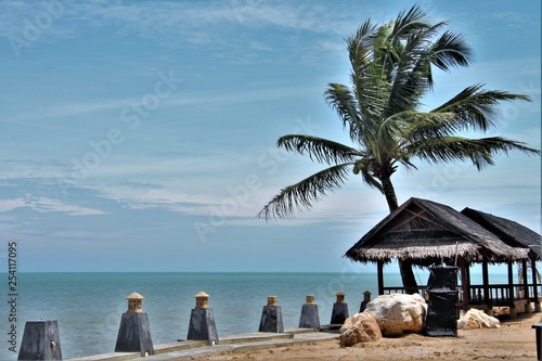 Fototapeta Naklejka Na Ścianę i Meble -  tropical beach with chairs and umbrellas