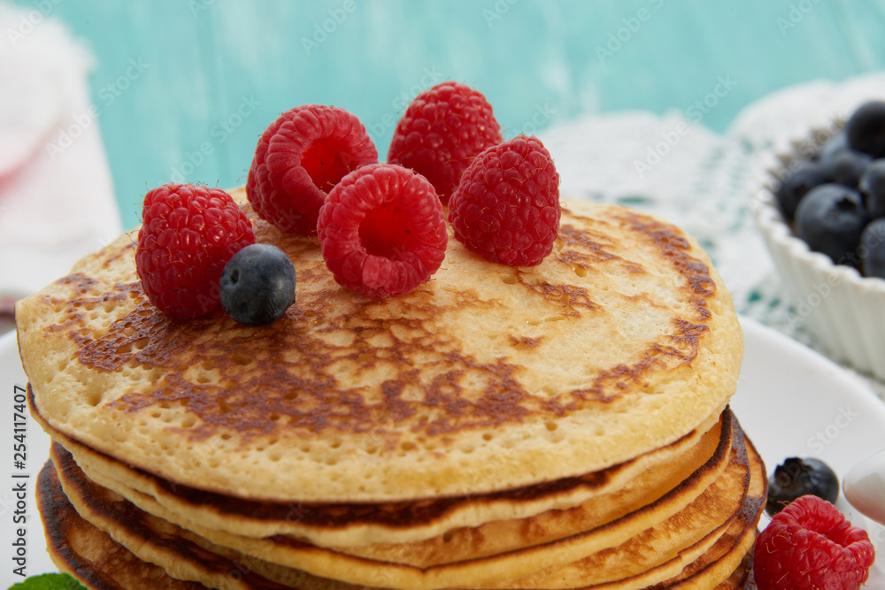 pancakes with fruit and maple syrup