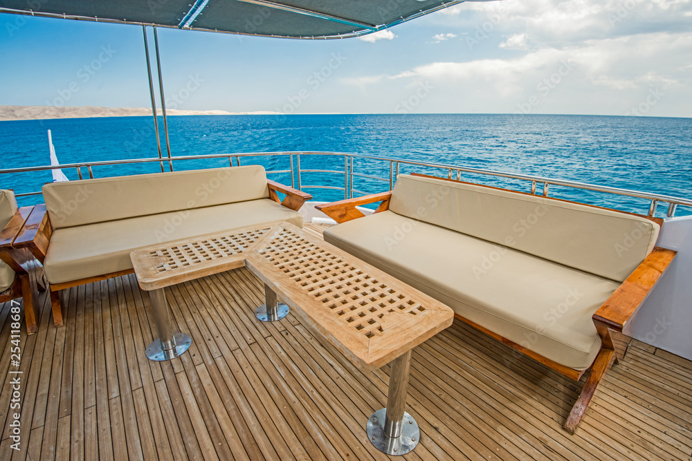 Fototapeta premium Table and chairs on deck of a luxury motor yacht
