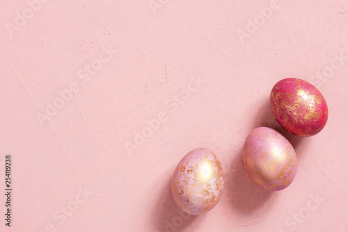 Banner with pink Easter eggs with golden spots