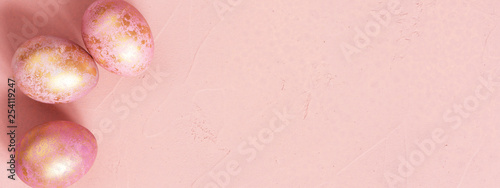 Banner with pink Easter eggs with golden spots
