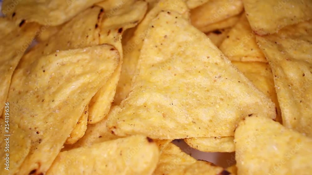 tortilla corn chips closeup texture video on rolling rotating looping plate tortilla corn chips closeup texture video on rolling rotating looping plate