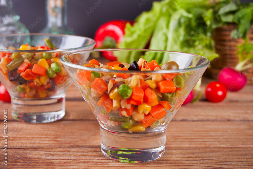 Homemade Mexican salad in a bowls with beans, corn, tomato, pepper and other vegetables. Homemade Mexican salad in a bowls with beans, corn, tomato, pepper and other vegetables.