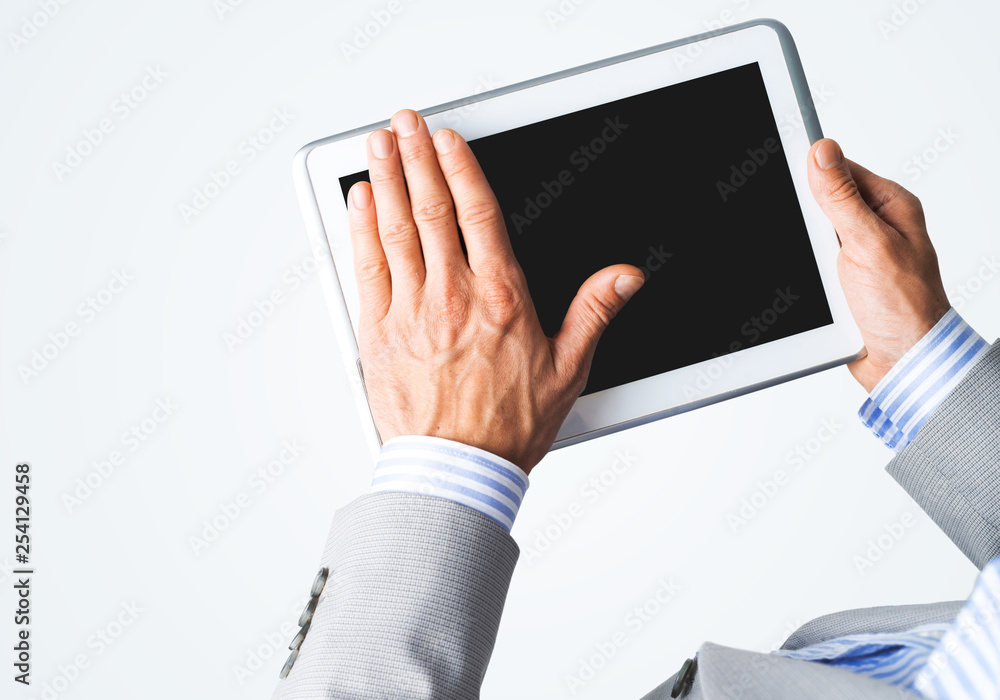 Hands of businessman holding tablet pc with black screen Hands of businessman holding tablet pc with black screen
