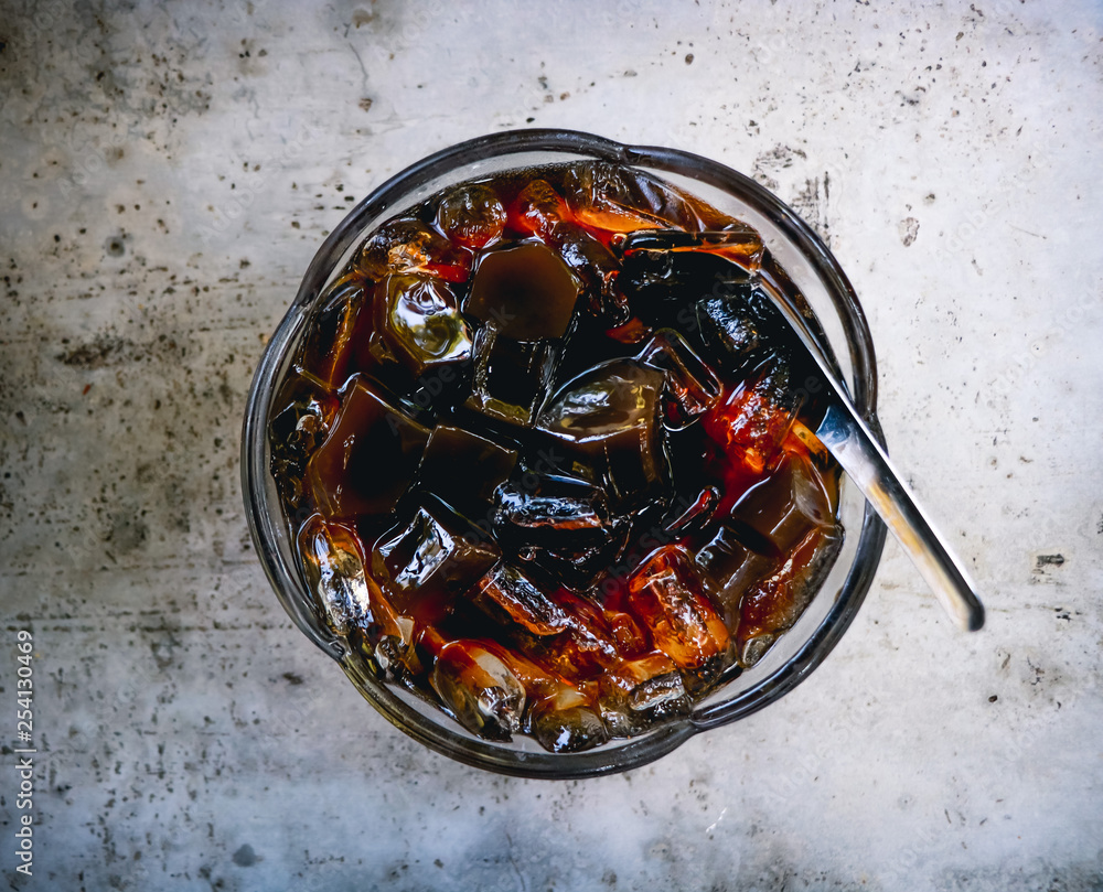 Grass jelly on the cement table. Top view with copy area.