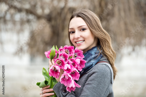 Woman with tulips. Beautiful woman with flowers.
