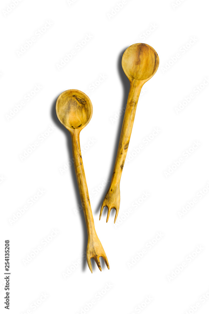 Two isolated wooden spoon forks made of apple wood. They have brown natural pattern on the surface.