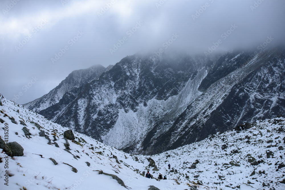 snow covered mountain tourist hiking trails