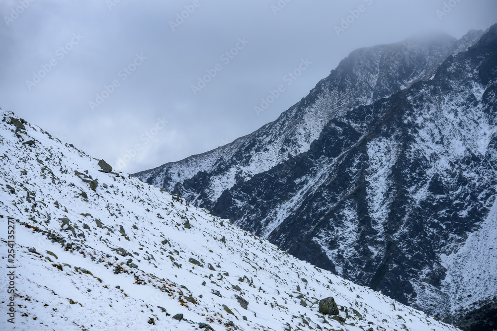 snow covered mountain tourist hiking trails
