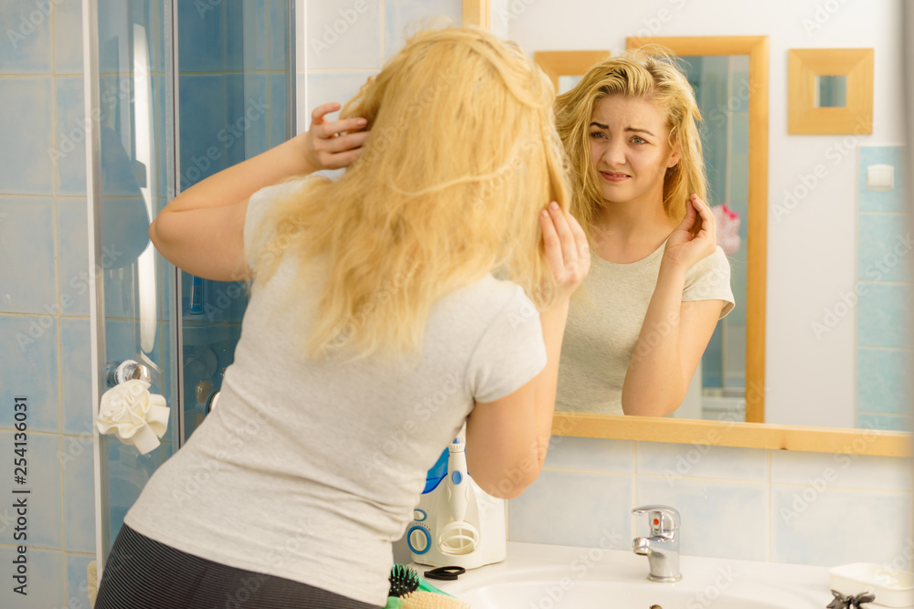 Female having problem with blonde hair Female having problem with blonde hair