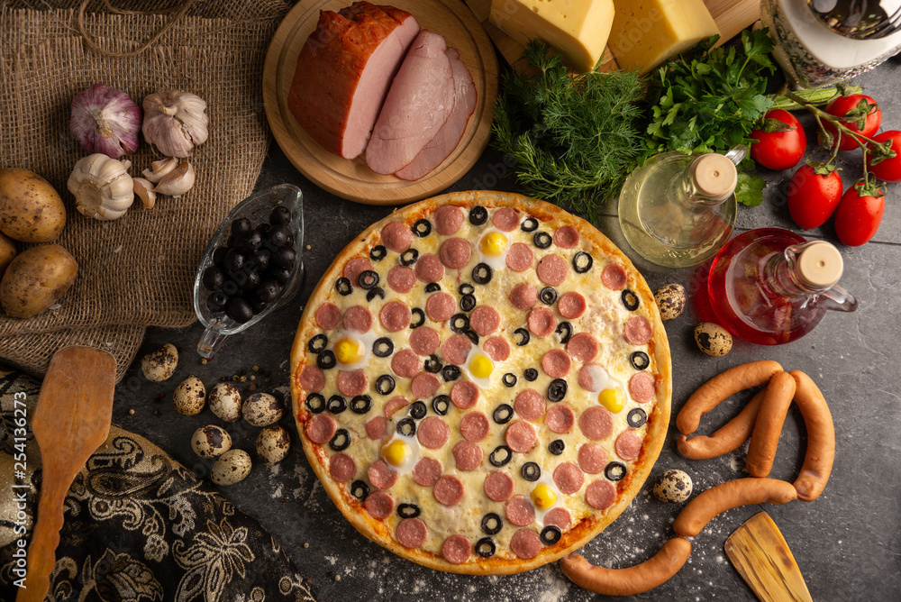 Pizza with sausages, boiled pork and quail eggs. Pizza with sausages, boiled pork and quail eggs.