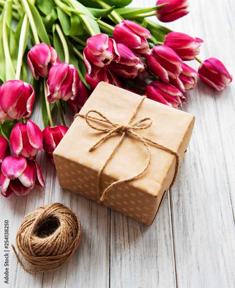 Gift box and tulips bouquet Gift box and tulips bouquet