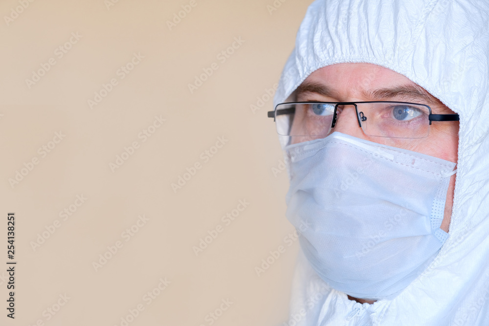 Lab technician, medic. On the face of a protective mask. Glasses. Protective suit. Lab technician, medic. On the face of a protective mask. Glasses. Protective suit.