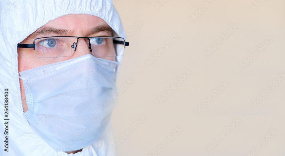 Lab technician, medic. On the face of a protective mask. Glasses. Protective suit. Lab technician, medic. On the face of a protective mask. Glasses. Protective suit.