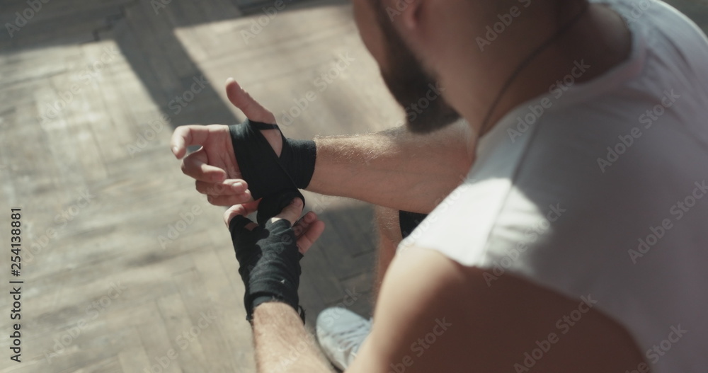 Boxer Wraps Hands. Man Boxer Wrapping Hands Getting Ready for a Fight