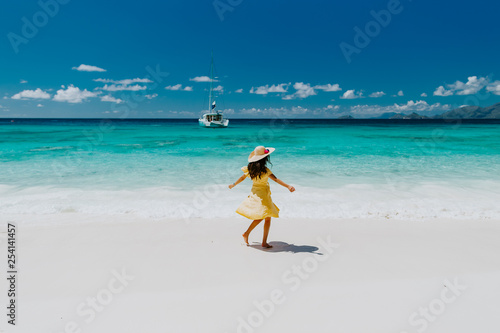woman travel tropical beach resort with yacht view