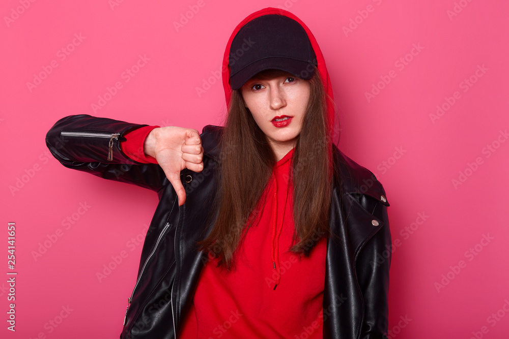 Fashion young woman uses bright red lipstick wears stylish shirt