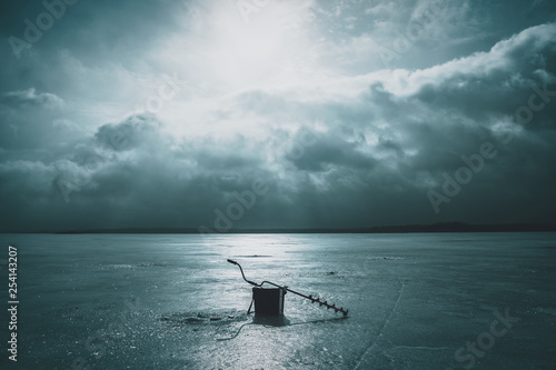 Fishing tackle on the ice of the lake. Ice fishing. photo