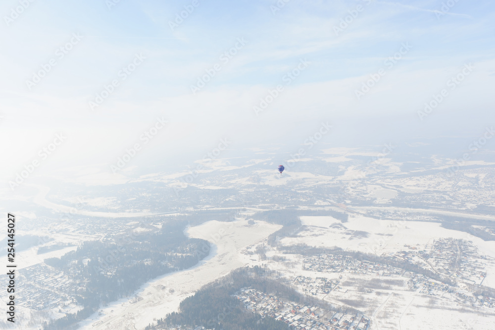 Balloon on the background of the winter landscape