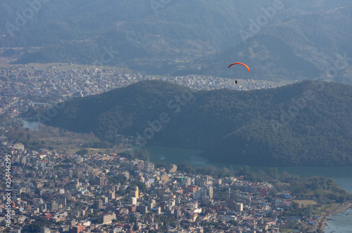 Parasailor Floating over a City