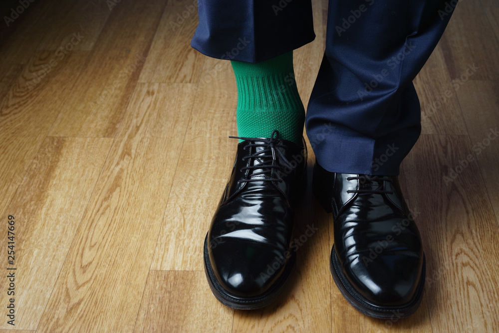A man in green socks and a blue suit, joke, St. Patrick's Day