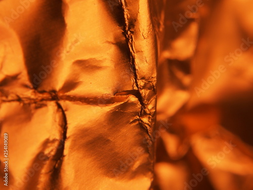 Golden metallic structure. The texture of the foil.