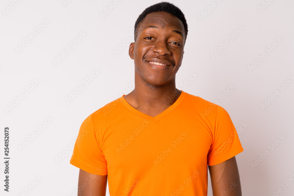 Face of young happy African man smiling Face of young happy African man smiling