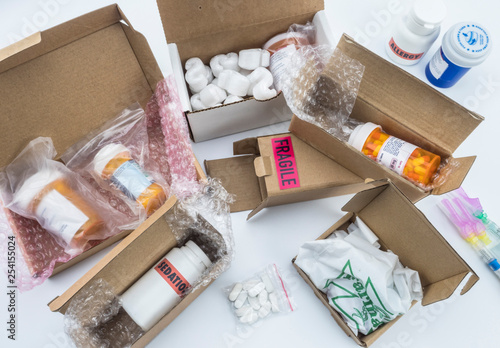 unpacking medication in boxes, Diverse medicines in boxes for humanitarian aid, conceptual image