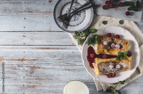 Cheese blintzes pancakes with fresh fruit photo