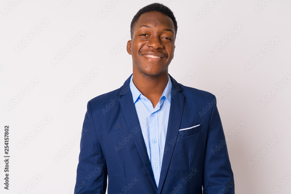 Face of young happy African businessman in suit smiling Face of young happy African businessman in suit smiling