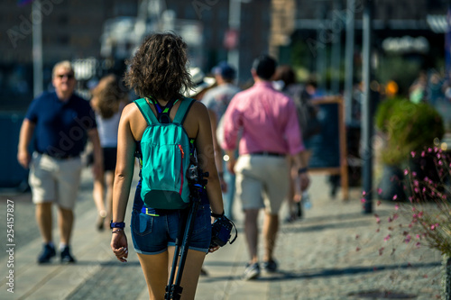 Young, sporty woman in going by the street of Stockholm, Sweden.