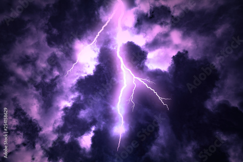 Lightning strike on the cloudy dark sky.