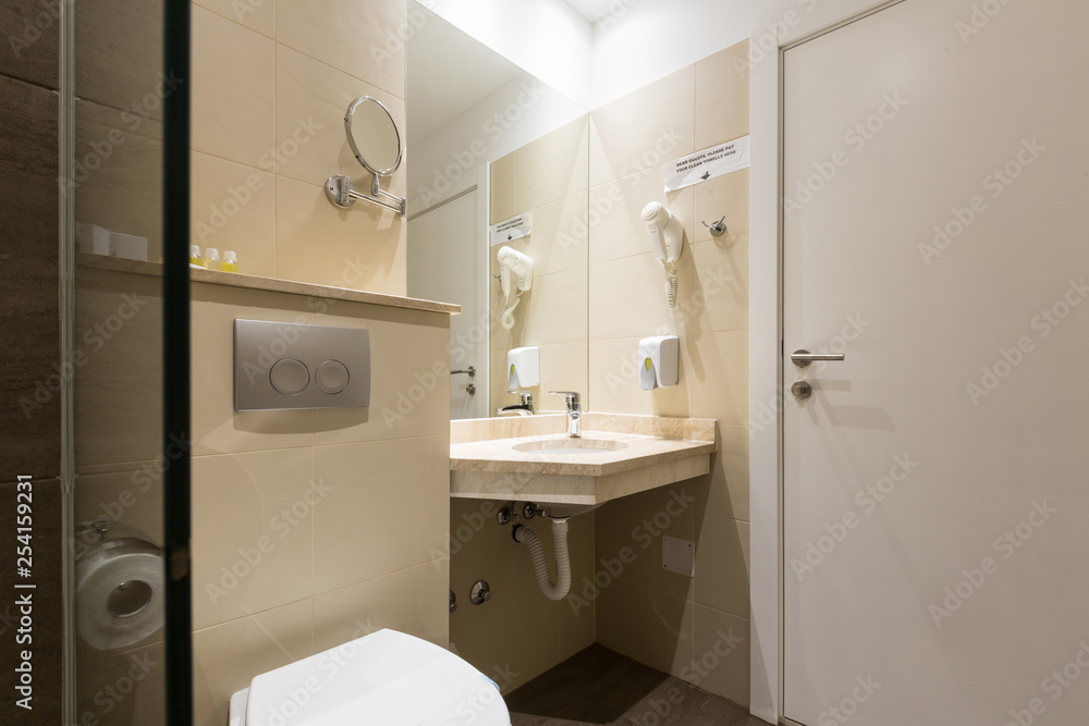 Hotel bathroom interior with shower cabin