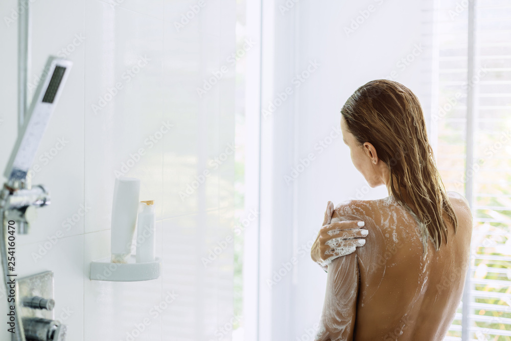 Woman taking bathroom in the morning Woman taking bathroom in the morning