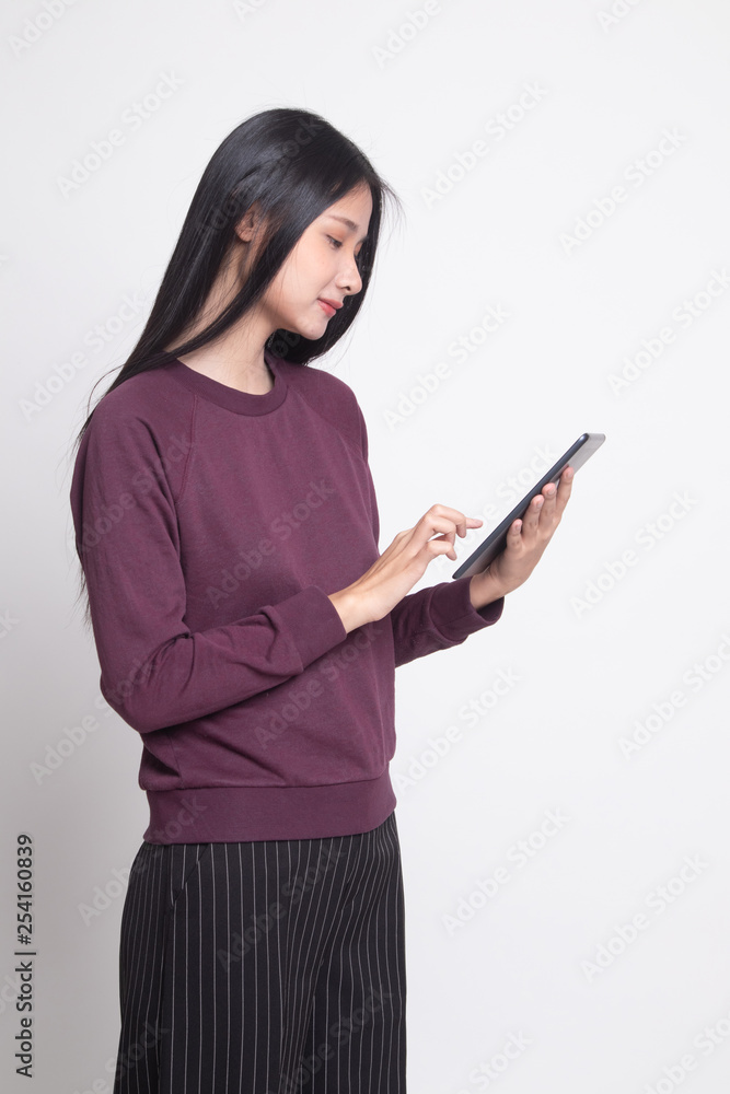 Young Asian woman with a computer tablet. Young Asian woman with a computer tablet.