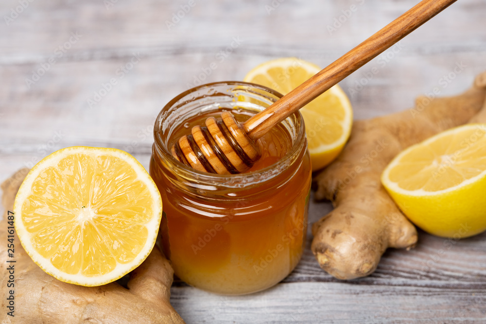 Close-up. Honey. Lemon. Ginger. Healthy concept. T Treatment of cold and viruses. Be healthy Close-up. Honey. Lemon. Ginger. Healthy concept. T Treatment of cold and viruses. Be healthy