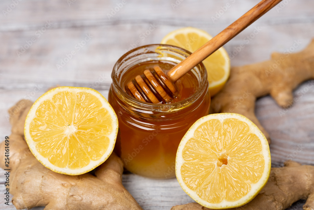 Close-up. Honey. Lemon. Ginger. Healthy concept. T Treatment of cold and viruses. Be healthy Close-up. Honey. Lemon. Ginger. Healthy concept. T Treatment of cold and viruses. Be healthy