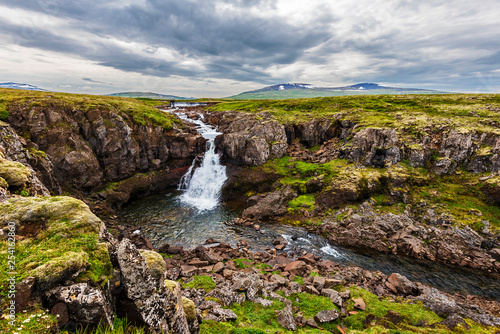 Wild landscape of rocky lands and rivers in Vesturland region of Iceland along Laxardalsvegur road.