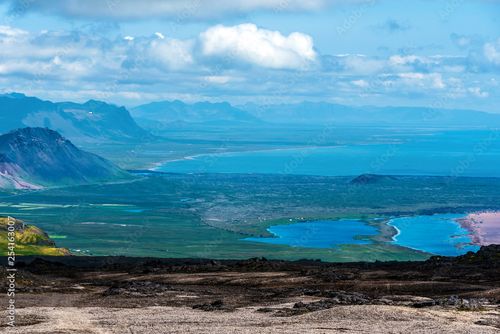 Faxa Bay coastline as seen from Snaefellsjokull mountain slope in Snaefellsnes peninsula. Faxa Bay coastline as seen from Snaefellsjokull mountain slope in Snaefellsnes peninsula.