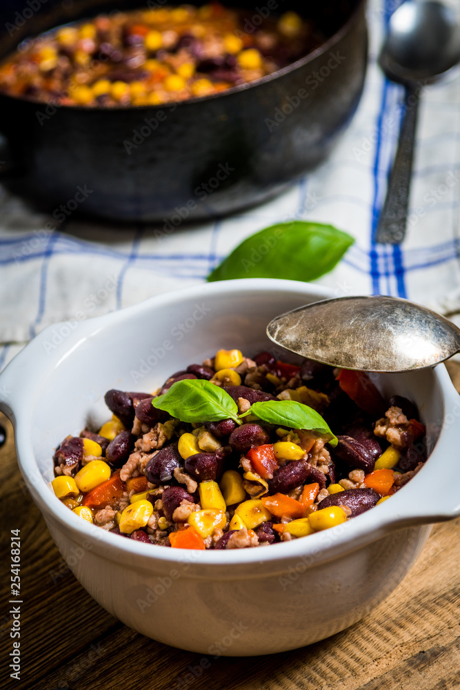 Fototapeta premium Chili corn carne on wood table